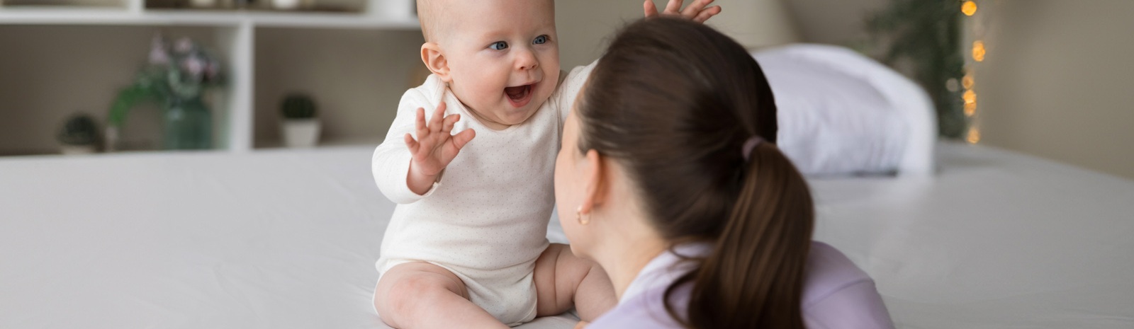 a mother and her baby playing