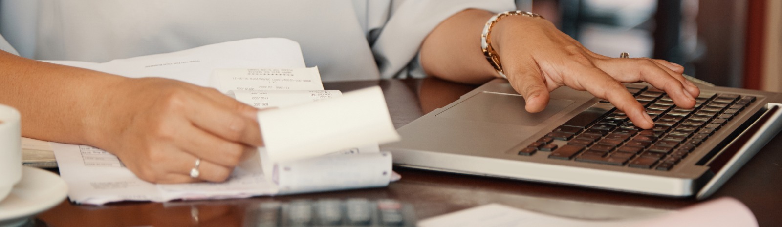 a person using their computer to calculate funds