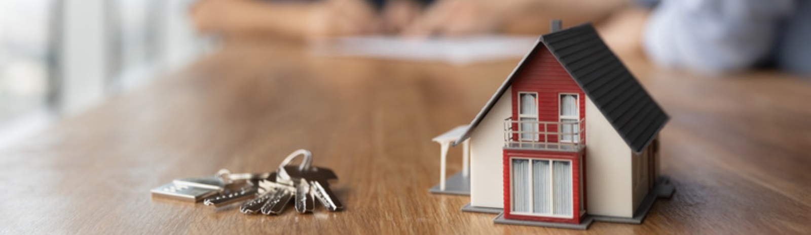 keys next to a small model home