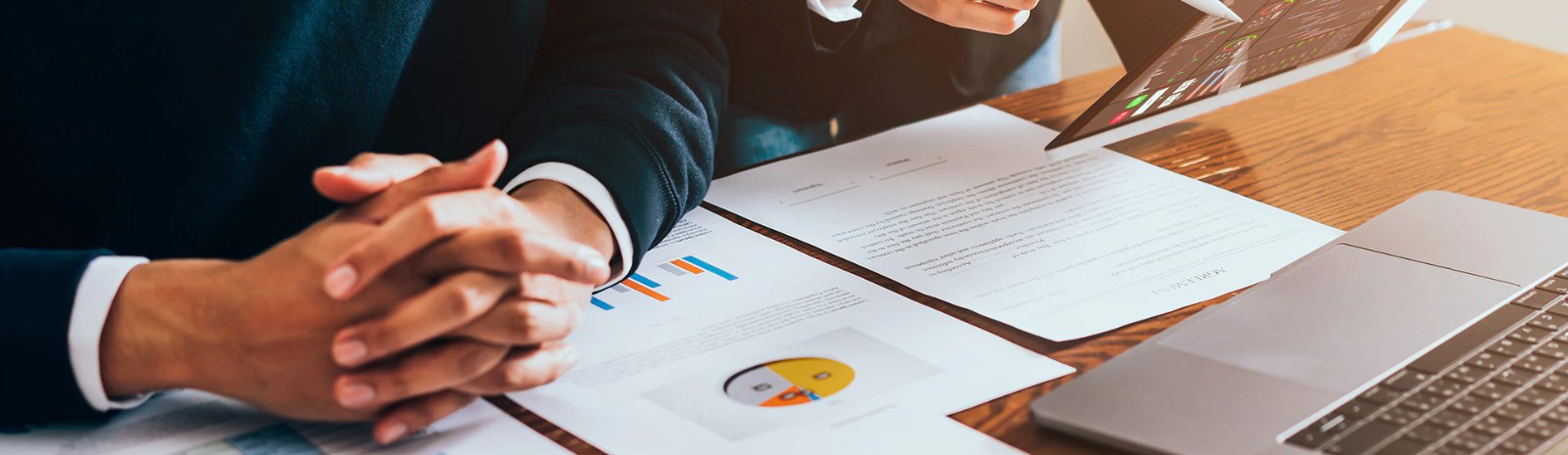 a group of people discussing financial documents