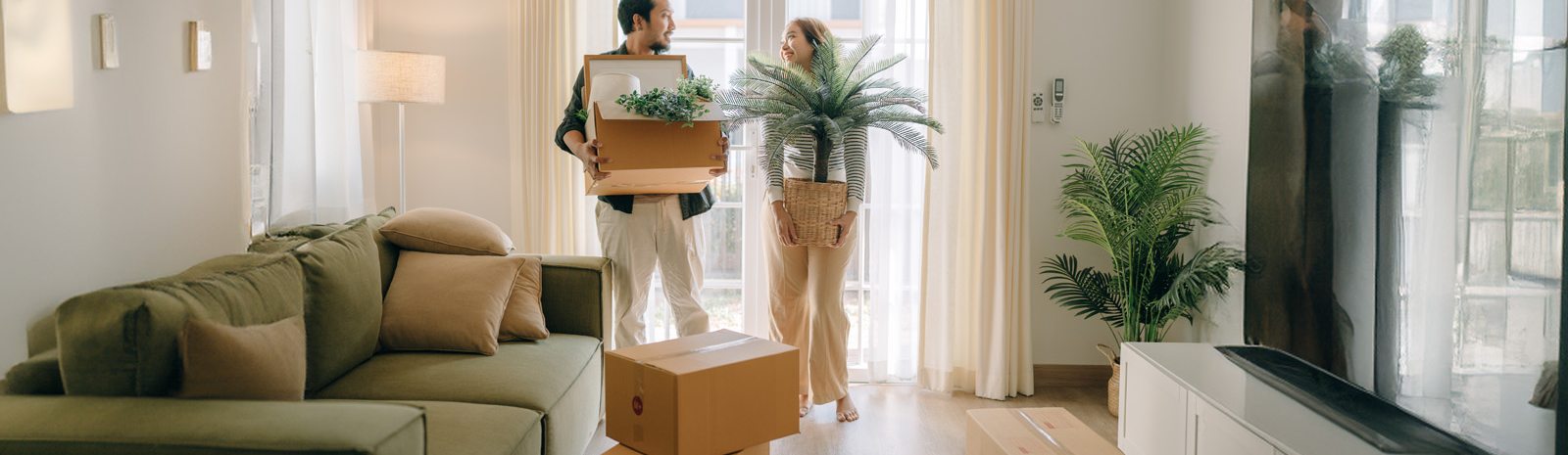 a couple standing in their new home