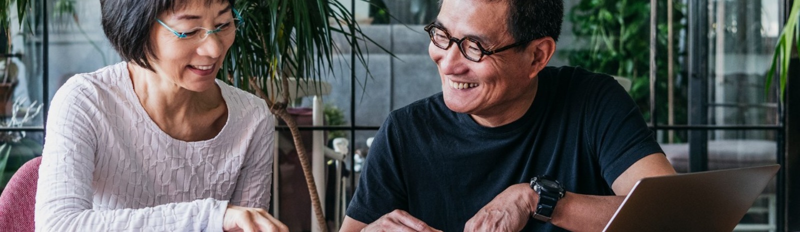 a couple using a laptop computer