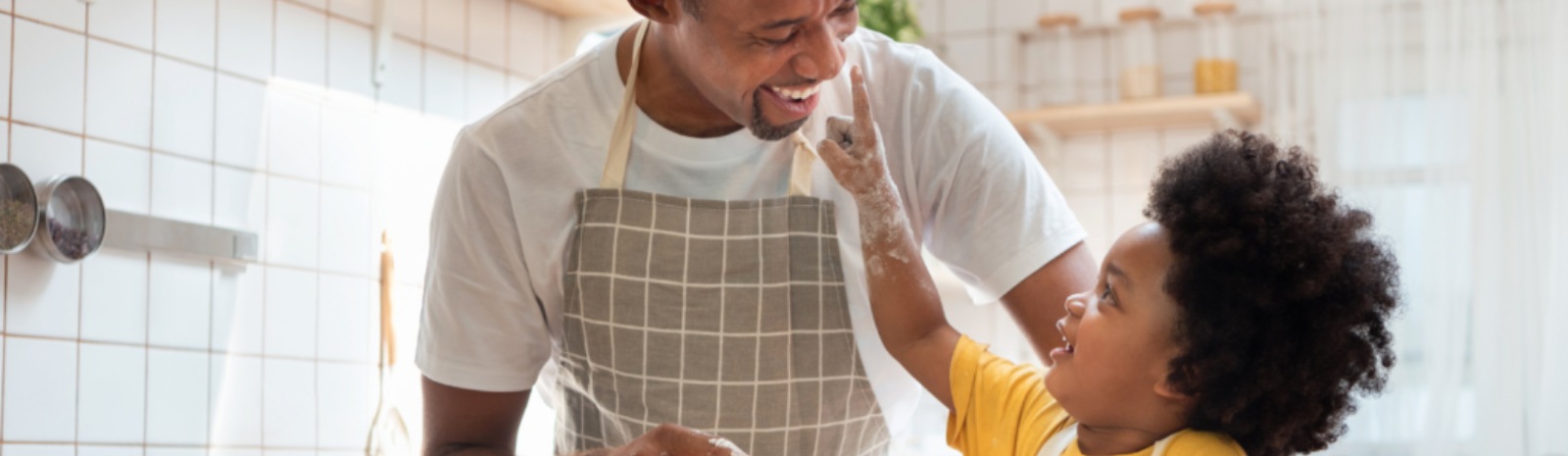 a father and child cooking